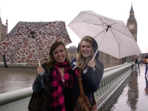 Two girls in London with Umbrellas